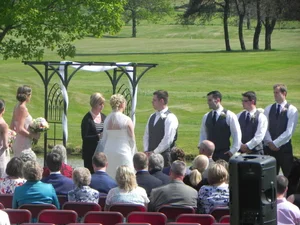 Full view of wedding party at the ceremony grounds