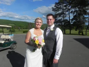 Newlyweds portrait with the golf course and valley as backdrop