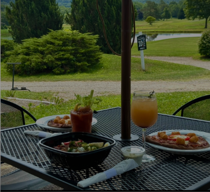 Patio dining area overlooking the golf course at Genegantslet Golf Club
