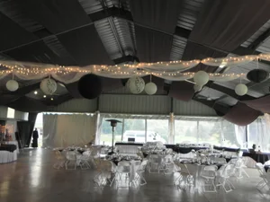 Wedding pavilion with white draping and string lights at Genegantslet Golf Club
