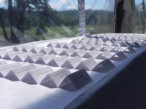 Place cards arranged near a window with mountain views